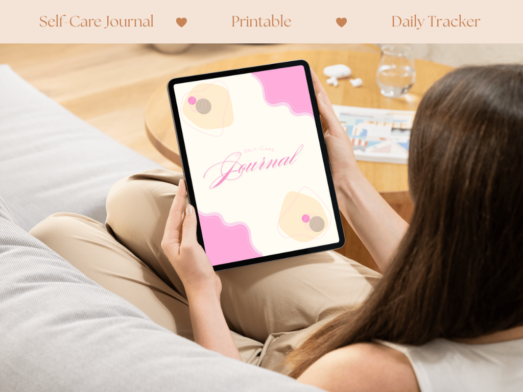 Person using a tablet with a self-care journal app on a couch by Elv X Beauty