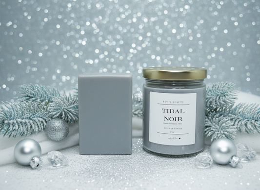 Candle and packaging with 'Tidal Noir' label on a festive background by Elv X Beauty